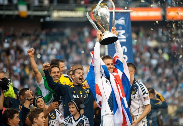 David Beckham hoists up the MLS Cup trophy after the Los Angeles Galaxy defeats the Houston Dynamo, 3-1, at The Home Depot Center...on December 1, 2012.