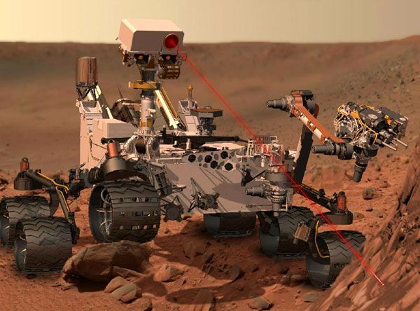An artist's concept of the Curiosity Mars rover firing its ChemCam laser at a rock.