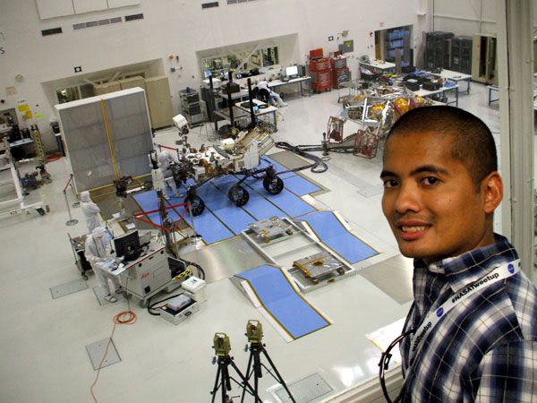 Posing with the Curiosity Mars rover and its descent stage behind me, at NASA's Jet Propulsion Laboratory on June 6, 2011.