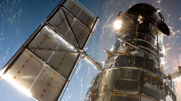 The Hubble Space Telescope is placed inside space shuttle Atlantis' payload bay by the crew members of mission STS-125, on May 13, 2009. The Hubble Space Telescope is placed inside space shuttle Atlantis' payload bay by the crew members of mission STS-125, on May 13, 2009.