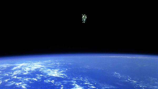 Strapped to a Manned Maneuvering Unit, Bruce McCandless II floats away from space shuttle Challenger during mission STS-41B in 1984. Strapped to a Manned Maneuvering Unit, Bruce McCandless II floats away from space shuttle Challenger during mission STS-41B in 1984.