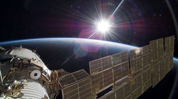 The Sun shines over the Russian segment of the International Space Station. The Sun shines over the Russian segment of the International Space Station.
