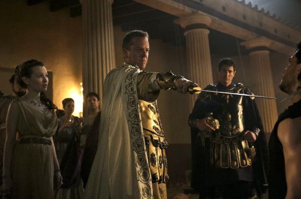 As Cassia (Emily Browning) looks on, Corvus (Kiefer Sutherland) confronts Milo (Kit Harington) in POMPEII. As Cassia (Emily Browning) looks on, Corvus (Kiefer Sutherland) confronts Milo (Kit Harington) in POMPEII.