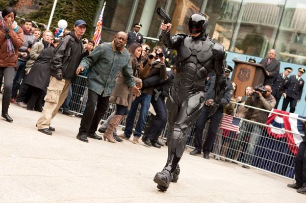 Donning black tactical armor, Alex Murphy is about to neutralize a criminal who was hiding amongst the crowd in ROBOCOP. Donning black tactical armor, Alex Murphy is about to neutralize a criminal who was hiding amongst the crowd in ROBOCOP.