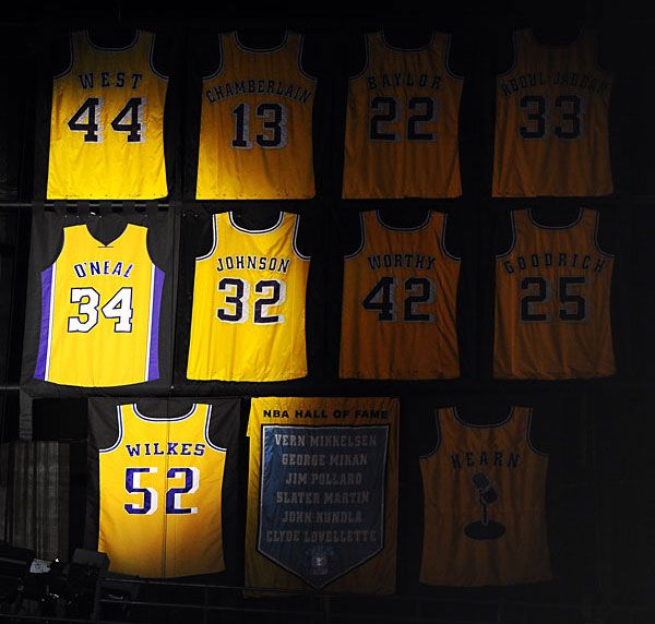 Despite the fact his last name and number was apparently printed on the wrong side, Shaq's jersey hangs next to those of other Laker legends on the rafters at STAPLES Center, on April 2, 2013.