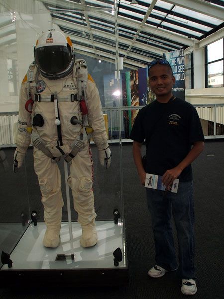 Posing with Felix Baumgartner's 'spacediver' flight suit at the California Science Center in Los Angeles, on October 13, 2013.