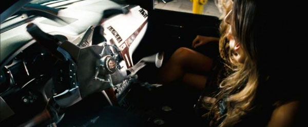 The socialite gets her comeuppance when Steering Wheel Bot attacks her in TRANSFORMERS.