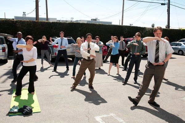 The employees of Dunder Mifflin do a morning workout session during the series finale of THE OFFICE.