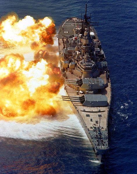 The battleship USS Iowa fires her nine 16-inch guns in a 1984 firepower demonstration.