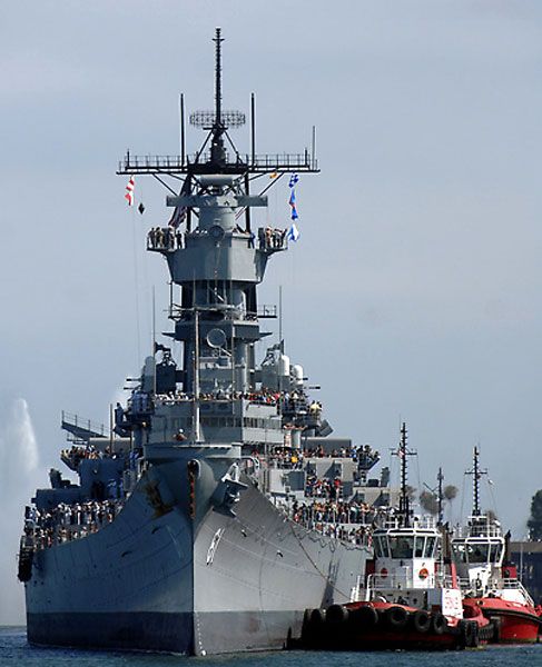 Escorted by tugboats, the USS Iowa makes her way to Berth 87 at San Pedro's waterfront on June 9, 2012.