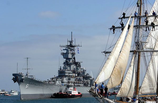 Spectators on a tall-masted ship watch as the USS Iowa makes her way to Berth 87 at San Pedro's waterfront, on June 9, 2012.