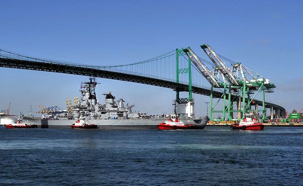 Passing underneath the Vincent Thomas Bridge, the USS Iowa makes her way to Berth 87 at San Pedro's waterfront...on June 9, 2012.