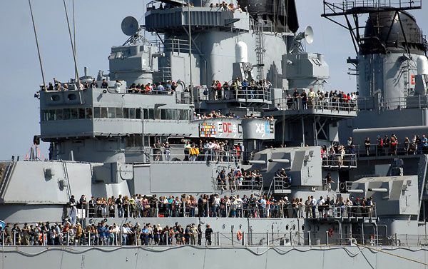 Hundreds of people gather on USS Iowa's decks as she makes her way to Berth 87 at San Pedro's waterfront, on June 9, 2012.