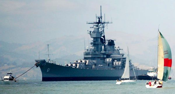 The USS Iowa is surrounded by sailboats and other vessels as the battleship embarks on a final trip to SoCal, on May 26, 2012.