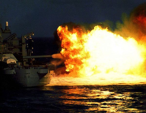 The USS Iowa fires her 16-inch guns during a naval exercise in the 1980s.