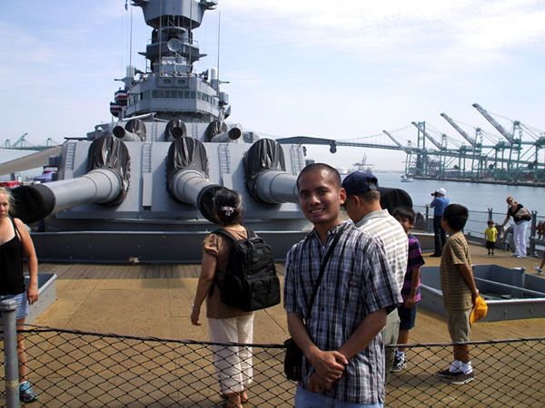 Posing in front of a 16-inch gun turret aboard the USS Iowa in San Pedro, California...on August 7, 2012.