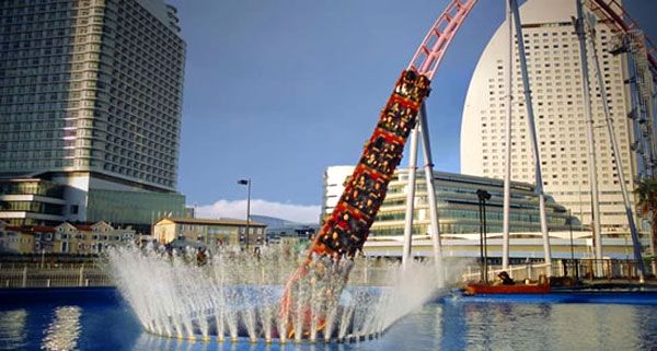 The Vanish roller coaster is about to enter a large pool of water at Yokohama Cosmo World in Japan.
