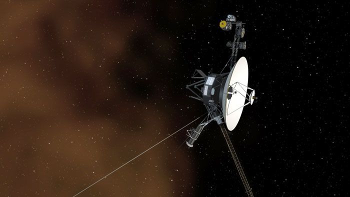 An art concept showing a Voyager spacecraft cruising through deep space.