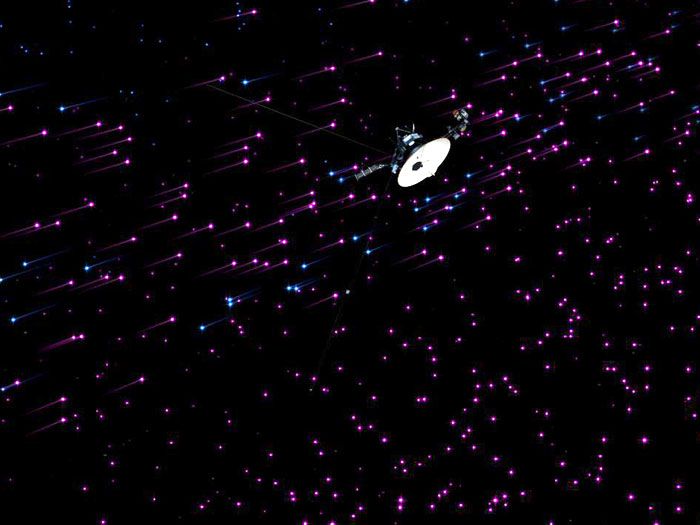 An art concept showing the Voyager 1 spacecraft flying through a region of space known as the 'magnetic highway.'