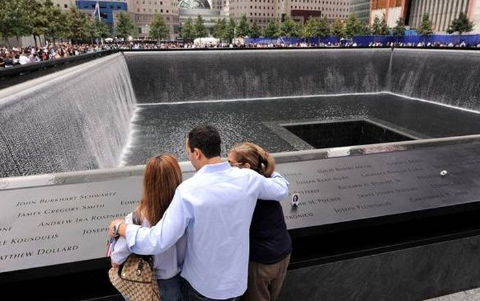 Family members of those who died in the World Trade Center attacks gather at the National September 11 Memorial on the 10-year anniversary of the tragedy.