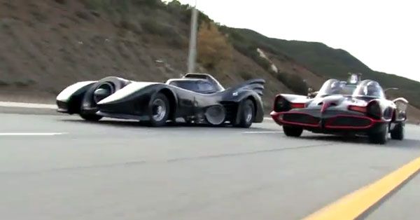 The two Batmobiles cruise along as they try to beat each other to the finish line.