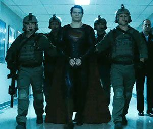Superman (Henry Cavill) is placed into custody by U.S. soldiers in MAN OF STEEL.