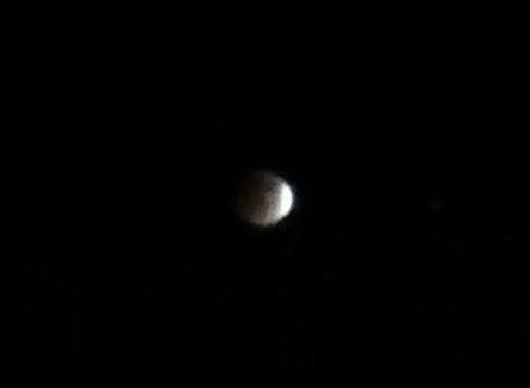 The Moon is about to be concealed by Earth's shadow prior to the total lunar eclipse on April 14-15, 2014. I took this photo using my Android RAZR phone.