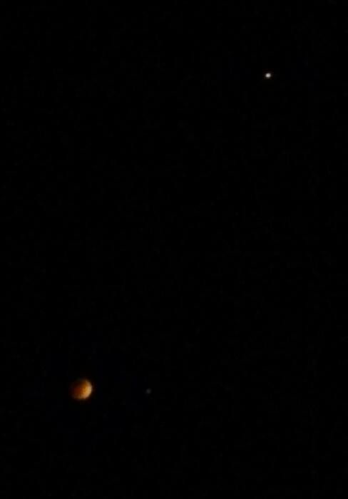 The Blood Moon and Mars (upper right-hand corner) lurk up in the night sky during the total lunar eclipse on April 14-15, 2014. I took this photo using my Android RAZR phone.