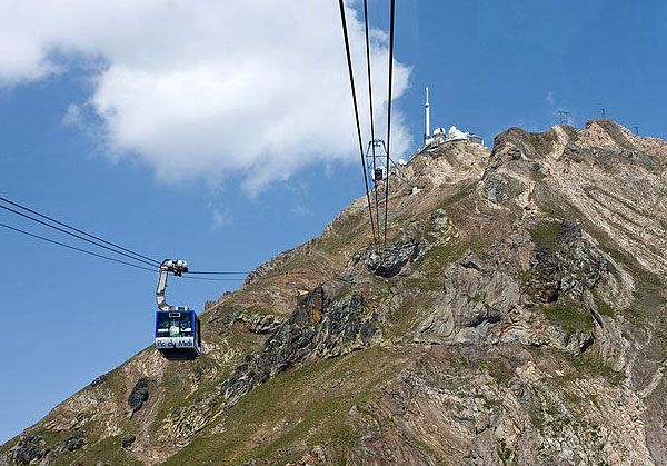Cable cars approach the observatory atop Pic du Midi de Bigorre.
