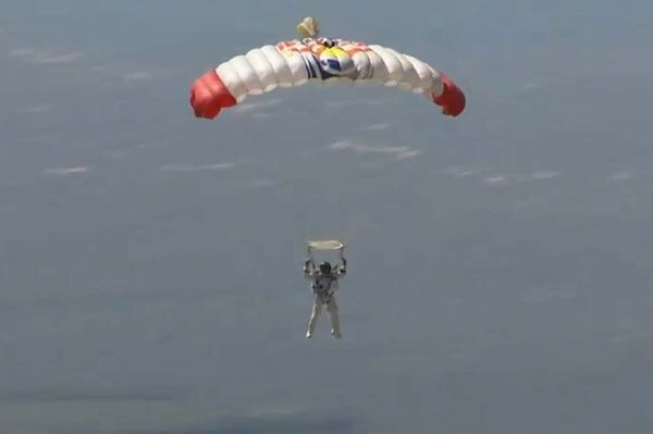 Austrian BASE jumper Felix Baumgartner glides to the ground as he successfully completes his spacedive on October 14, 2012.