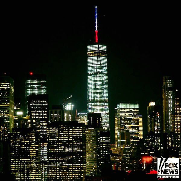 The antenna spire on the 1 World Trade Center is lit up in the colors of the French flag...to show solidarity for the people of Paris following the terrorist attacks on November 13, 2015.