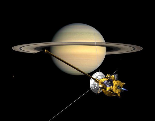 A composite image showing the Cassini spacecraft orbiting Saturn.