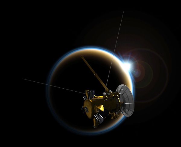 An artist's concept depicting NASA's Cassini spacecraft flying past Saturn's moon Titan.