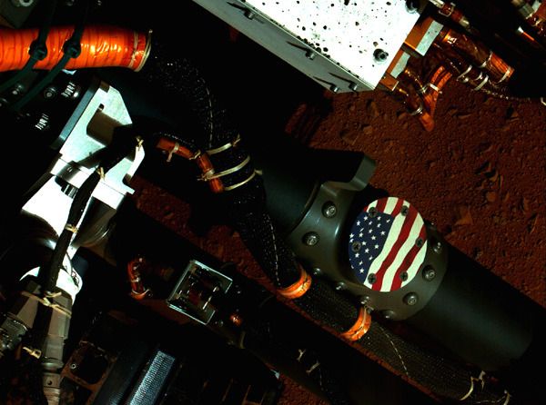 The American flag on the Curiosity Mars rover's robotic arm...as seen by the spacecraft's Mars Hand Lens Imager (MAHLI) on September 19, 2012.