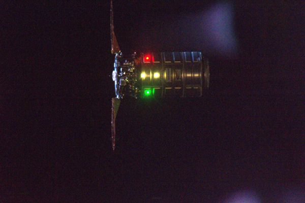 Flying in Earth's shadow, Cygnus Orb-4 (also known as the 'S.S. Deke Slayton II') floats near the ISS as its robotic arm (not visible) waits to grapple the cargo freighter on December 9, 2015. Flying in Earth's shadow, Cygnus Orb-4 (also known as the 'S.S. Deke Slayton II') floats near the ISS as its robotic arm (not visible) waits to grapple the cargo freighter on December 9, 2015.