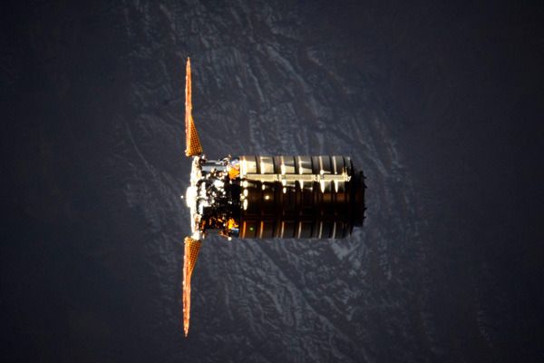 Emerging from Earth's shadow, Cygnus Orb-4 (also known as the 'S.S. Deke Slayton II') floats near the ISS as its robotic arm (not visible) waits to grapple the cargo freighter on December 9, 2015. Emerging from Earth's shadow, Cygnus Orb-4 (also known as the 'S.S. Deke Slayton II') floats near the ISS as its robotic arm (not visible) waits to grapple the cargo freighter on December 9, 2015.