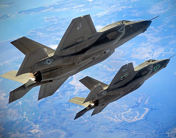 Two F-35B Lightning II fighter jets fly in formation above a test range near Naval Air Station Patuxent River in Maryland...on March 17, 2011.