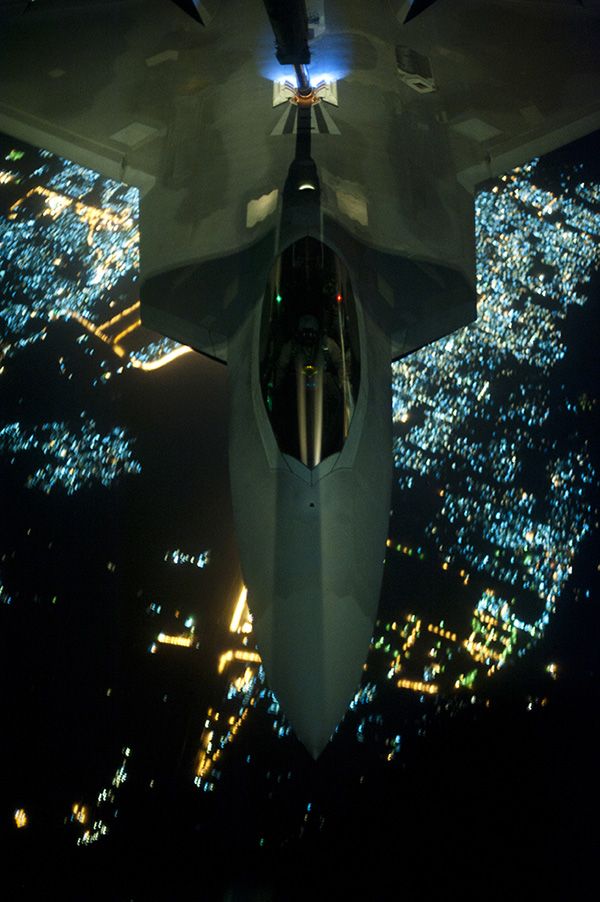 An F-22 Raptor gets refueled in mid-flight by a KC-10 Extender prior to conducting a combat sortie in Syria, on September 26, 2014.