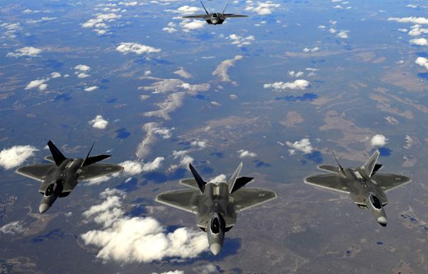 A squad of F-22 Raptors fly over Alaska.