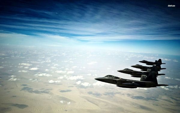 A squad of F-22 Raptors soar in the wild blue yonder.