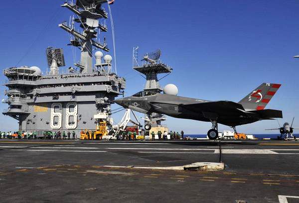An F-35C Lightning II is about to touch down on the USS Nimitz on November 3, 2014...marking the first time a Joint Strike Fighter jet made an arrested landing aboard an aircraft carrier.