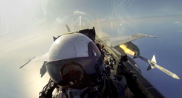 Captain Christopher Prout fires an AIM-7 Sparrow missile from his F/A-18C Hornet fighter jet on May 16, 2013.
