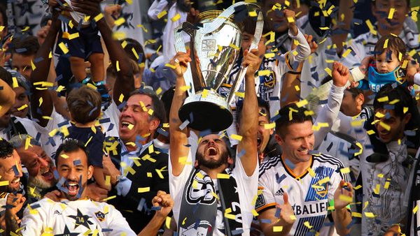 Landon Donovan hoists the MLS Cup trophy after the L.A. Galaxy defeats the New England Revolution, 2-1, at the StubHub Center in Carson, California...on December 7, 2014.