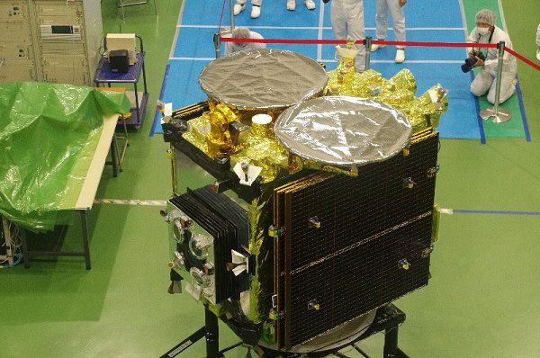 JAXA's asteroid-bound Hayabusa 2 spacecraft is unveiled during a special event at the Samagihara spacecraft assembly facility in Japan, on August 31, 2014.