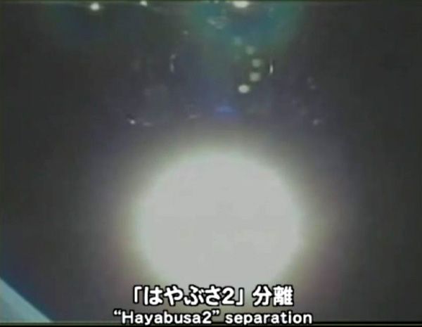A camera aboard the H-IIA rocket captured this image of Hayabusa 2 shortly after spacecraft separation (the five target markers are visible underneath the robotic probe), on December 3, 2014 (Japan time).