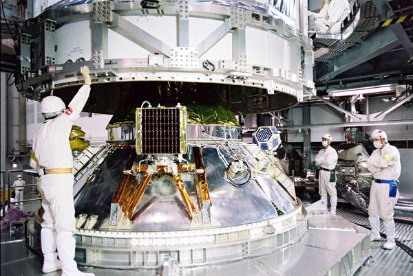 At the Tanegashima Space Center in Japan, JAXA's Hayabusa 2 spacecraft is about to be encapsulated by the payload fairing of its H-IIA launch vehicle...on November 17, 2014.