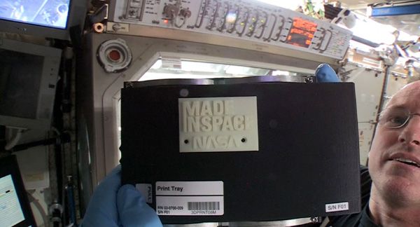 ISS commander Barry Wilmore shows off the first 3-D printed part made in space. The piece was manufactured on November 24, 2014. ISS commander Barry Wilmore shows off the first 3-D printed part made in space. The piece was manufactured on November 24, 2014.