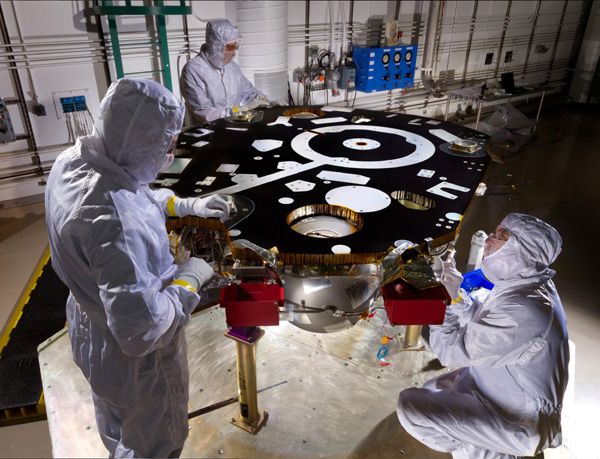 Engineers work on NASA's InSight Mars lander at Lockheed Martin Space Systems in Denver, Colorado...on October 31, 2014.
