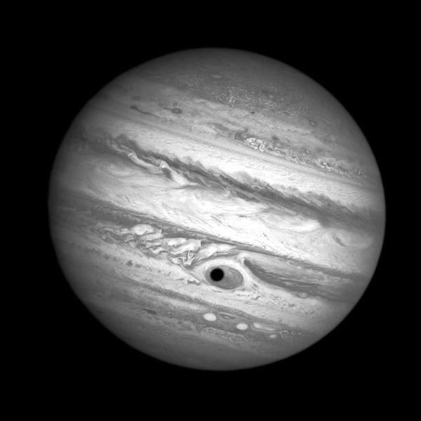 Jupiter's moon Ganymede casts a shadow on the giant planet's Great Red Spot, in this image taken by the Hubble Space Telescope on April 21, 2014.