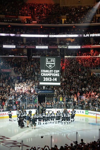 The L.A. Kings and their fans watch as the 2014 Stanley Cup championship banner is raised towards the rafters at STAPLES Center, on October 8, 2014.